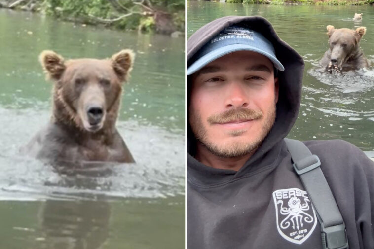 fisherman-takes-selfie-in-front-of-ravenous-grizzly-in-beary-dangerous-stunt