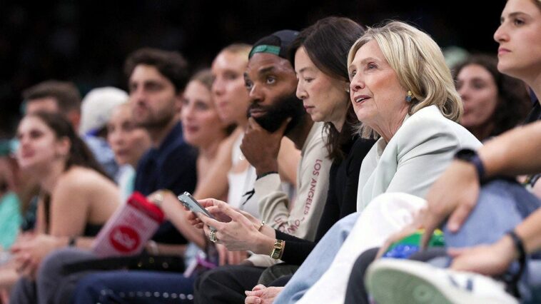 hillary-clinton-appears-mesmerized-by-wnba-team’s-dancing-elephant-mascot
