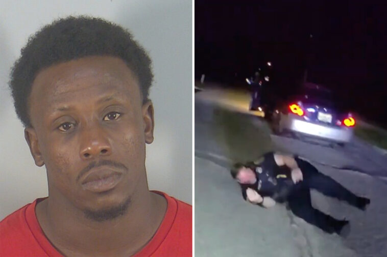 fleeing-suspect-speeds-off-with-an-officer-still-trapped-inside-car-during-routine-traffic-stop:-video