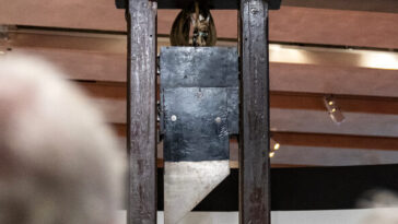 watch:-protestors-show-up-with-guillotine-at-city-council-meeting-and-scare-off-data-center-reps