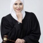 deep-red-mississippi-hands-black-robe-to-full-hijab-yemeni-immigration-attorney-who-guides-illegals-to-citizenship-paths