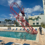 crane-arm-collapses-into-miami-condo-rooftop-pool-area-as-workers-cling-to-dangling-structure