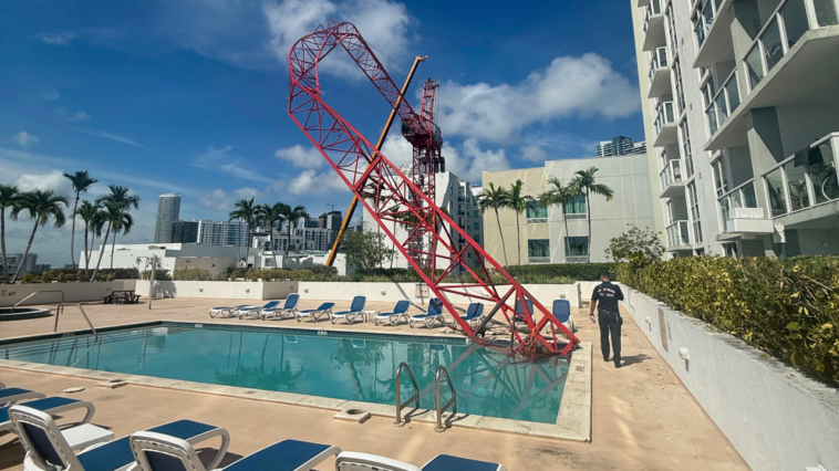 crane-arm-collapses-into-miami-condo-rooftop-pool-area-as-workers-cling-to-dangling-structure