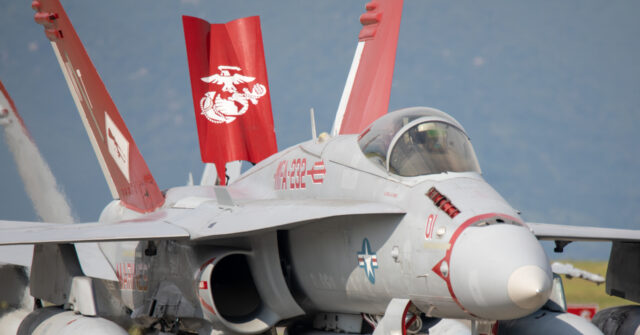 watch:-marine-pilot-shows-up-on-rural-road-after-ejecting-from-f-18-about-to-crash
