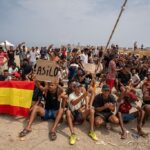 hundreds-of-illegal-migrants-demand-asylum-after-storming-spanish-beach