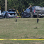 police-fatally-shoot-sword-wielding-man-after-woman-found-trapped-in-car,-officials-say