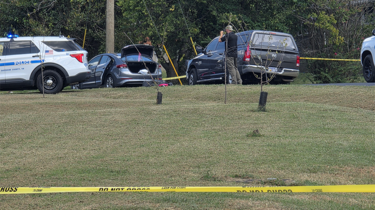 police-fatally-shoot-sword-wielding-man-after-woman-found-trapped-in-car,-officials-say