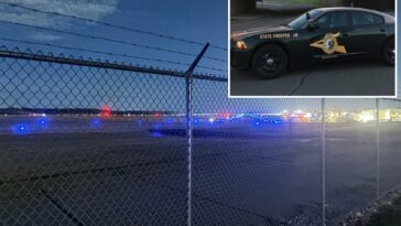 airport-chaos-erupts-after-driver-suddenly-smashes-through-fence,-hits-plane-and-tractor:-police