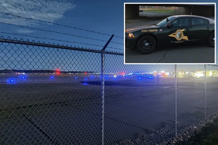 airport-chaos-erupts-after-driver-suddenly-smashes-through-fence,-hits-plane-and-tractor:-police
