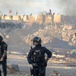 watch:-spanish-police-fire-warning-shots-during-growing-tensions-outside-ceuta-migrant-shelter