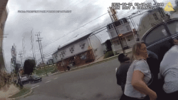watch:-bystanders,-police-lift-volkswagen-off-woman-pinned-underneath-after-dramatic-e-bike-crash
