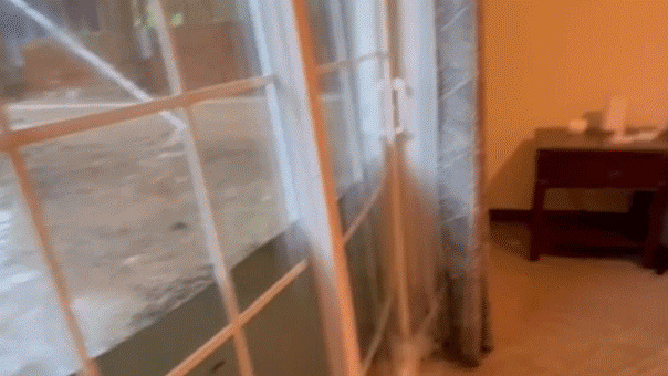 dramatic-video-captures-floodwaters-bursting-through-glass-doors-of-college-students’-home