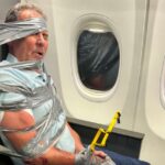 unhinged-airplane-passenger-duct-taped-to-seat-by-gun-shop-owner-in-viral-moment
