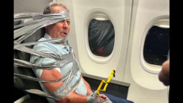 unhinged-airplane-passenger-duct-taped-to-seat-by-gun-shop-owner-in-viral-moment