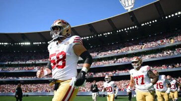 sold-out-melbourne-crowd-stands-for-25th-anniversary-commemoration-of-9/11-at-nfl’s-first-australia-game