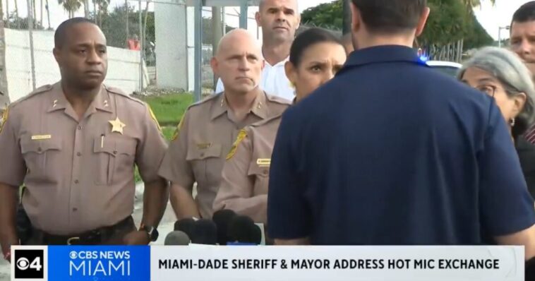 hot-mic:-sheriff-and-miami-mayor-fight-over-who-is-going-to-speak-first-at-amazon-plane-crash-presser-(video)