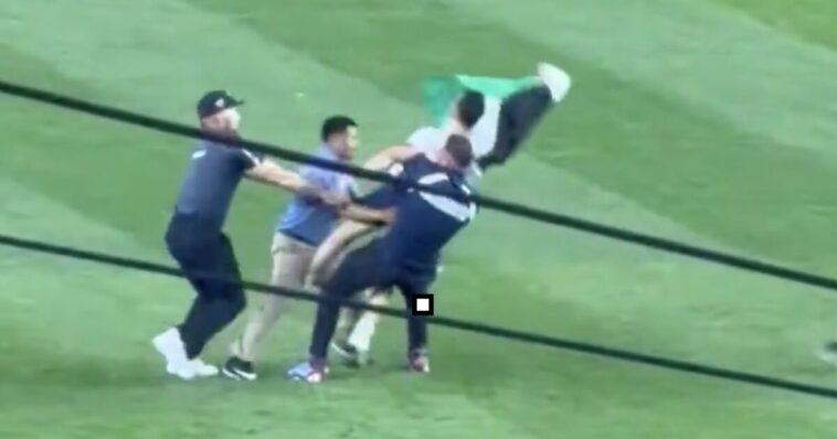 despicable:-palestinian-flag-waving-invader-storms-yankee-stadium-field-at-exactly-9:11-pm.-on-the-25th-anniversary-of-9/11-—-patriotic-fans-respond-with-“usa!”-chants-and-beer-cans