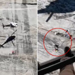 harrowing-moment-helicopter-hovers-frighteningly-close-to-cliff-face-to-rescue-fallen-climber