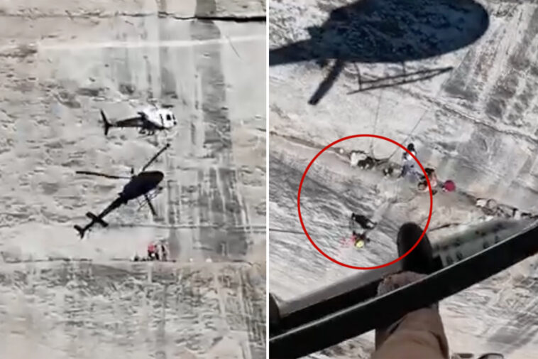 harrowing-moment-helicopter-hovers-frighteningly-close-to-cliff-face-to-rescue-fallen-climber