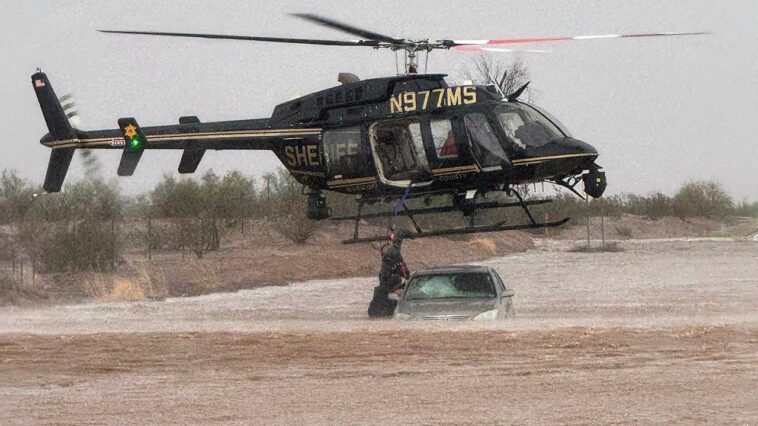 arizona-sheriff-deploys-helicopter-to-save-2-stranded-in-flooded-car