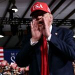 trump-halts-rally-speech-to-dismiss-female-heckler:-‘she’s-going-home-to-mama’