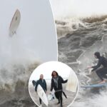 surfers-ignore-nor’easter-warnings-and-dangers,-catch-high-waves-off-rockaway-beach-during-wild-storms