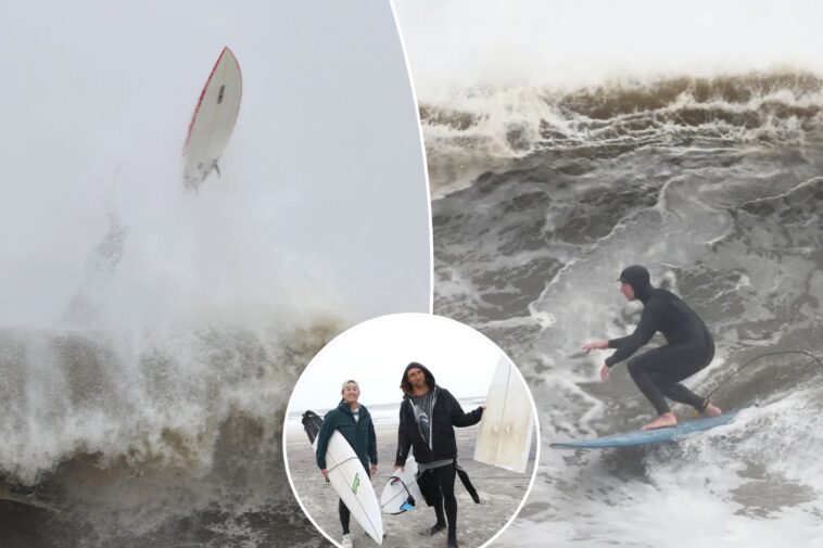 surfers-ignore-nor’easter-warnings-and-dangers,-catch-high-waves-off-rockaway-beach-during-wild-storms