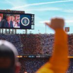 applause-erupts-as-crowd-of-over-100,000-sees-trump-on-the-jumbotron-at-major-sec-showdown