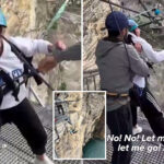 shocking-moment-staffers-kick-terrified-woman’s-legs-away-to-make-her-take-260-foot-thrill-jump