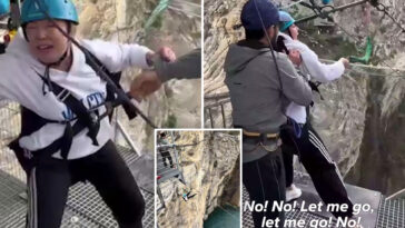 shocking-moment-staffers-kick-terrified-woman’s-legs-away-to-make-her-take-260-foot-thrill-jump