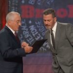 robert-de-niro-jokingly-prods-jimmy-kimmel-with-a-baseball-bat-while-posing-as-fcc-chair,-threatens-host