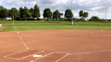 2-sisters,-both-adopted-to-separate-families,-meet-as-opposing-players-during-softball-game
