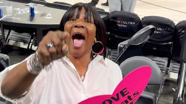 a’ja-wilson’s-mom-freaks-out-when-asked-to-explain-her-‘love-beats-hate’-sign-after-game-3-win-vs-fever