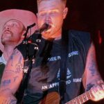 zach-bryan-‘bud-lights’-himself-—-us.-navy-vet-and-his-band-members-wear-t-shirts-with-unpopular-woke-messages-on-stage