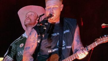 zach-bryan-‘bud-lights’-himself-—-us.-navy-vet-and-his-band-members-wear-t-shirts-with-unpopular-woke-messages-on-stage
