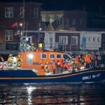 police-arrest-protesters-after-locking-down-town-to-clear-way-for-migrant-boat-landing