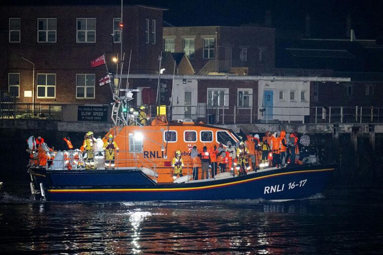 police-arrest-protesters-after-locking-down-town-to-clear-way-for-migrant-boat-landing