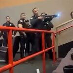 wild-moment-armed-cops-storm-california-movie-theater