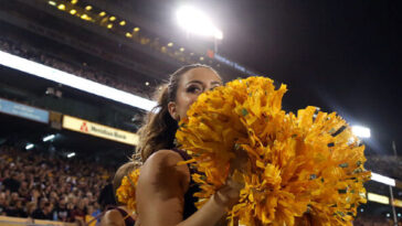 watch:-arizona-state-cheerleader-shoved-to-the-ground,-hit-by-cops-after-interfering-arrest