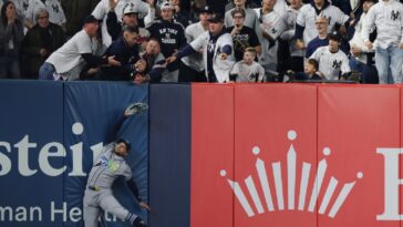 watch:-yankees-eliminated-from-playoffs-after-dramatic-fan-interference-incident