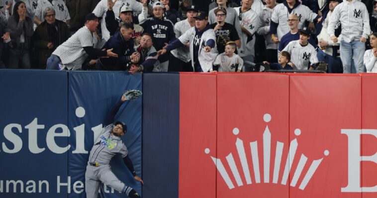 watch:-yankees-eliminated-from-playoffs-after-dramatic-fan-interference-incident