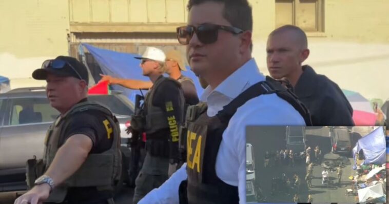 watch:-feds-storm-skid-row-with-a-100-vehicle-convoy-to-take-down-drug-network-operating-in-tents-and-storefronts