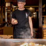 grinning-teppanyaki-chef-clearly-has-something-clever-planned-for-onion