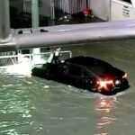 dramatic-moment-driver-trapped-on-top-of-her-car-after-tropical-storm-rachel-hit-las-vegas