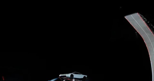 musk-unveils-flying-tesla-roadster-at-spacex-texas-site
