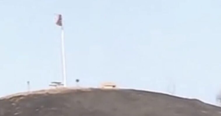 amazing!-american-flag-still-flying-on-top-of-patriots-hill-in-orange-county-after-fire-torches-hillside-(video)