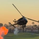 watch:-stunt-chopper-at-navy-seal-fundraiser-thrills-guests-with-small-explosions-and-red,-white-and-blue-smoke-show