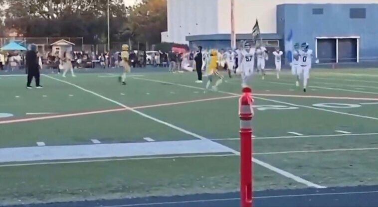 watch:-‘democrats’-football-player-levels-rival-carrying-american-flag-in-dirty-pre-game-hit