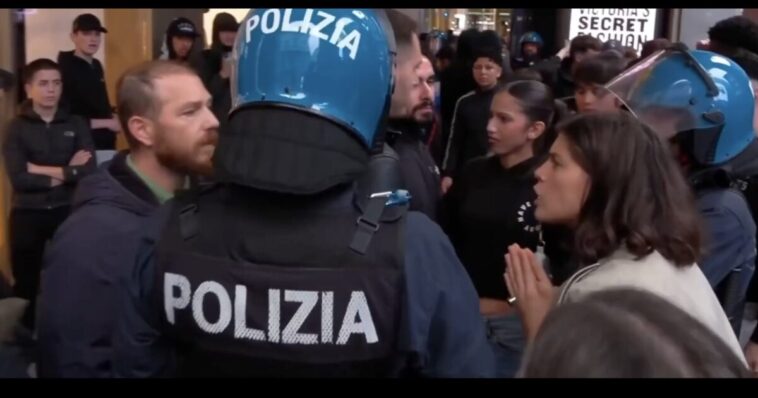 watch:-liberal-italian-woman-confronts-police-for-being-too-rough-with-third-world-migrant-rioters-—-seconds-later,-an-explosive-goes-off