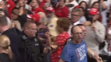 “really-unattractive”-leftist-gets-clocked-after-screaming-at-trump-at-rally-–-trump-calls-supporter-“evander-‘the-real-deal’-holyfield”-–-crowd-roars!-(video)